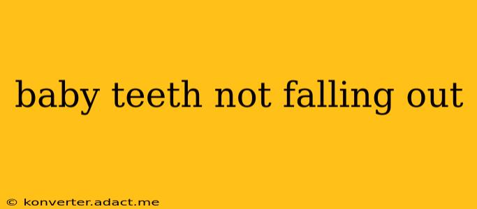 baby teeth not falling out
